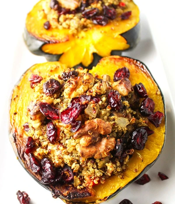 Roasted Acorn Squash With Cranberry Walnut Quinoa Stuffing on the counter.
