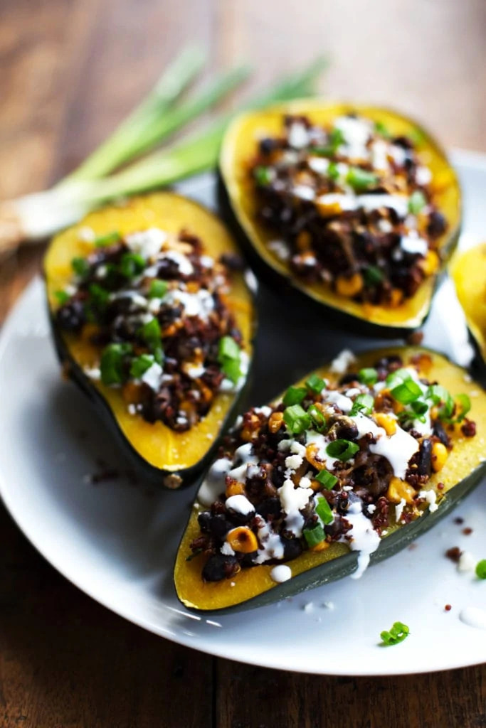 Mexican roasted stuffed squash on a white plate.