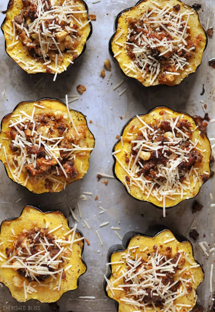 Stuffed squash in a scalloped baking individual tins with parmesan on the top.