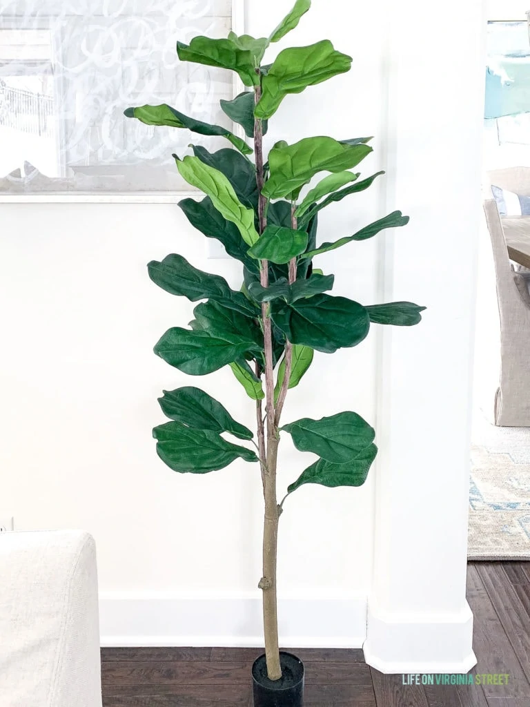 An affordable faux fiddle leaf fig tree. Looks great with the planter pot or basket of your choice!