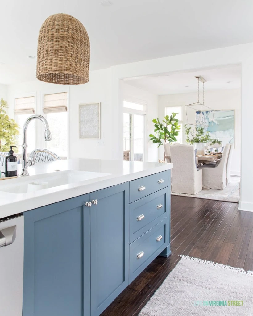 A spring kitchen looking into a blue and white dining room. Love the subtle spring accents!