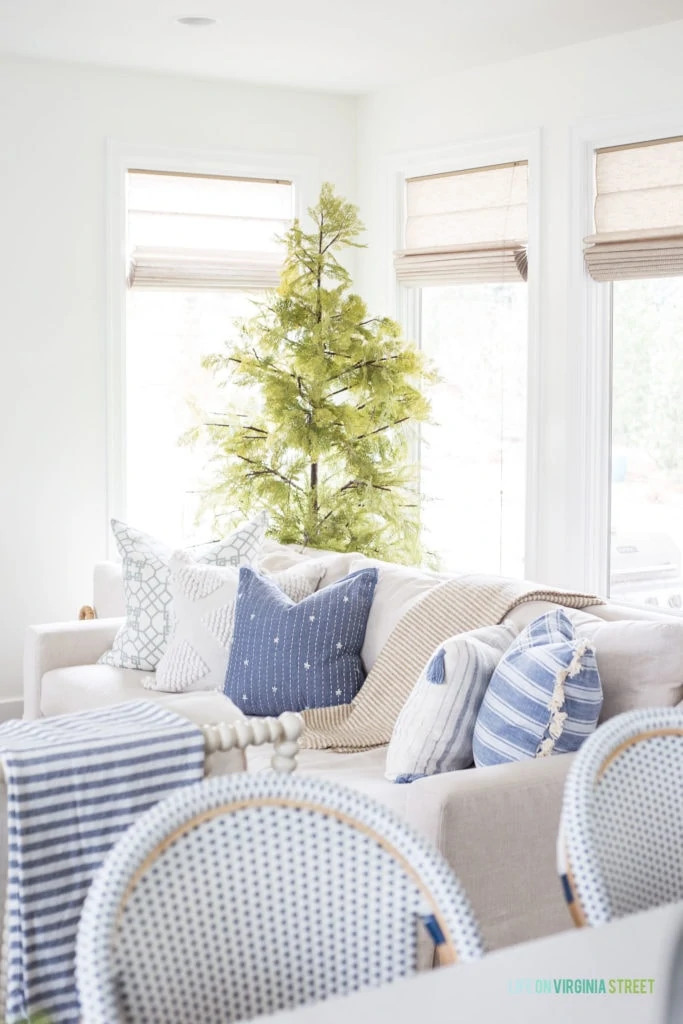 Affordable spring throw pillows from TJ Maxx online. I love the linen sofa paired with the blue and white pillows.