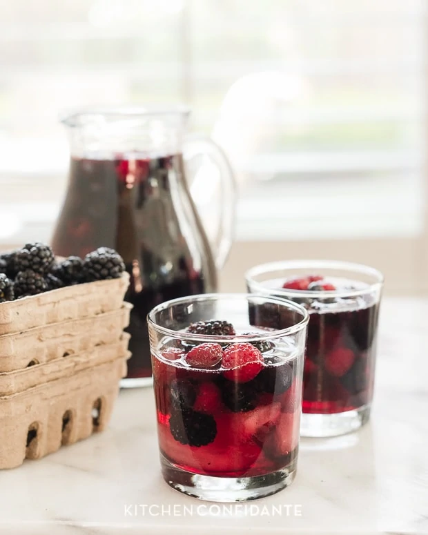 Berry Sangria with blackberries and raspberries in the glass cups.