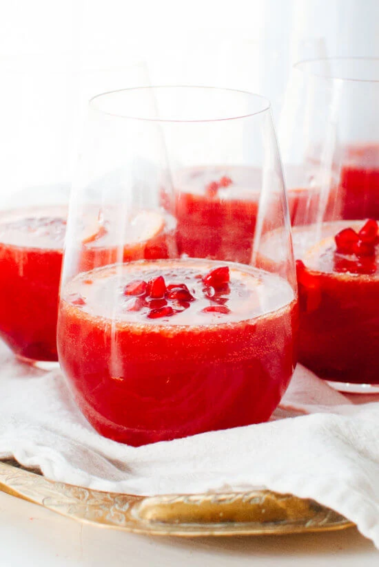 Blood Orange and Pomegranate Sparkling Sangria cups on the table.