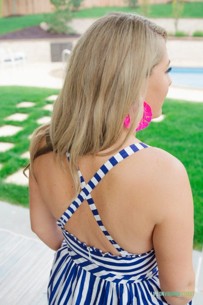 Criss crossed straps on the back of the striped dress.