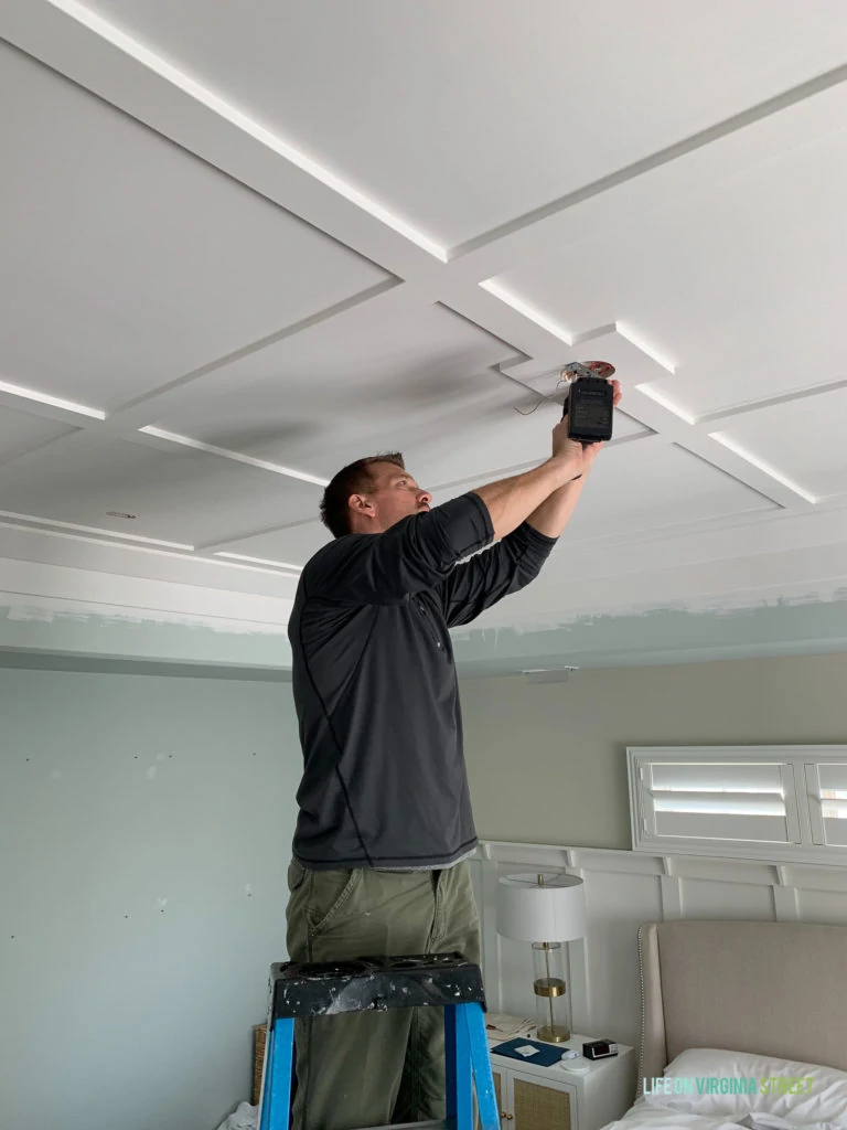 The ceiling painted and putting in the hardware for the light fixture.