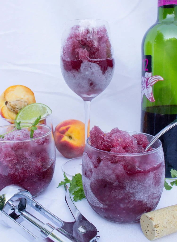 Peach Sangria Granita which has a dark purple slushy in it.