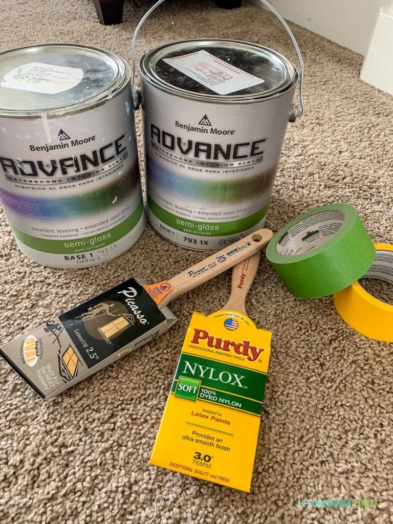 Paint cans, brushes and Frogtape in preparation for painting.