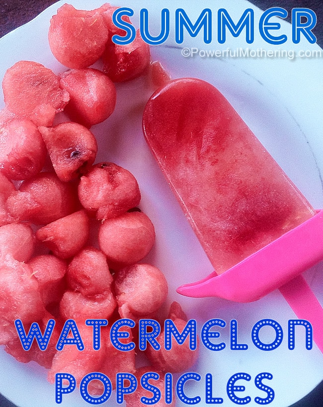 Watermelon popsicles with watermelon balls on a white plate beside the frozen popsicle.