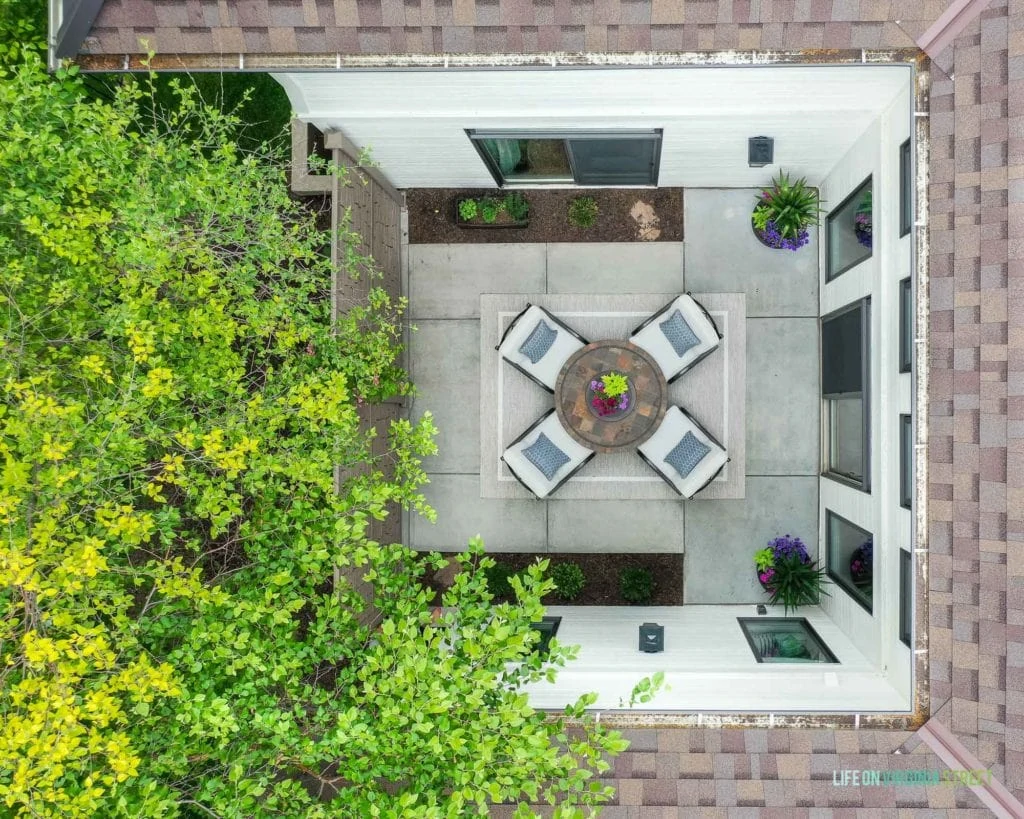 An aerial view of the courtyard looking down onto the small patio with chairs.