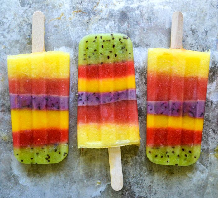 Whole Fruit Popsicles Recipe that are layered with color.