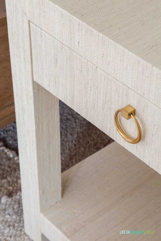 Raffia textured nightstands beside the bed.