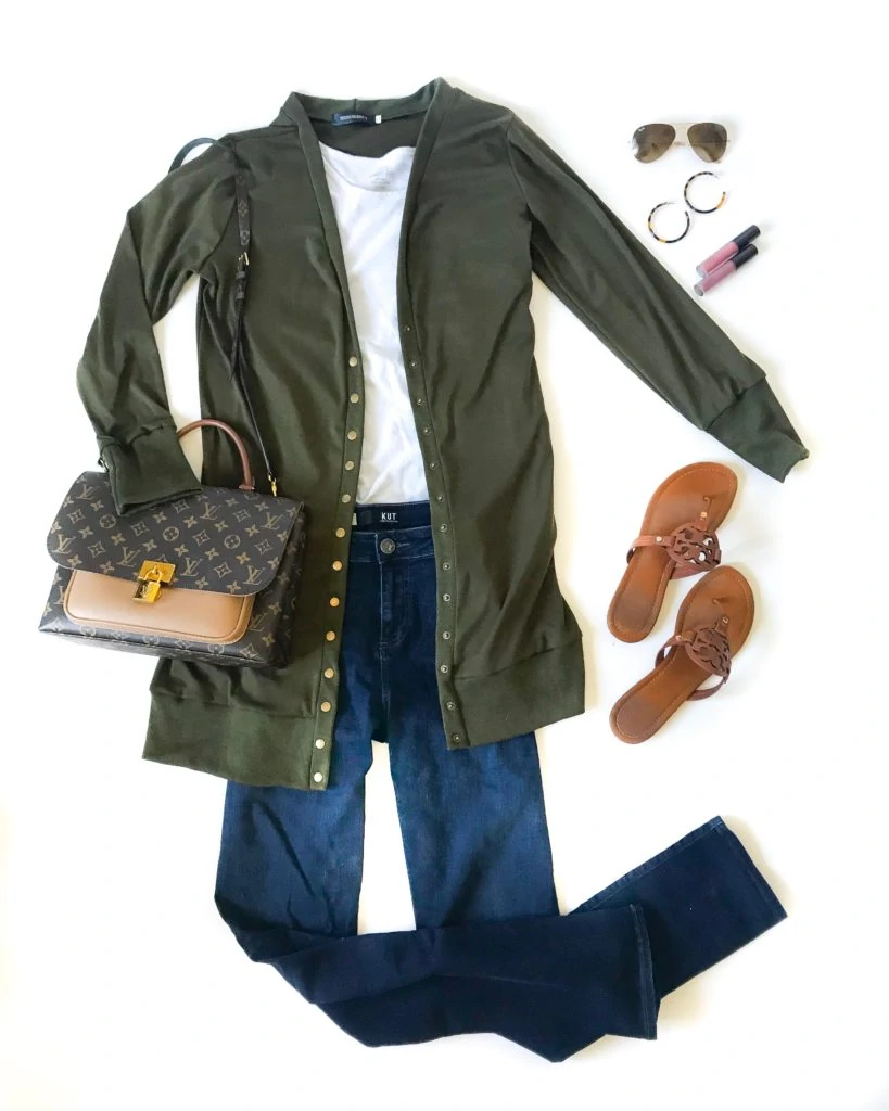 Olive green cotton light jacket sweater, flat shoes, and jeans.