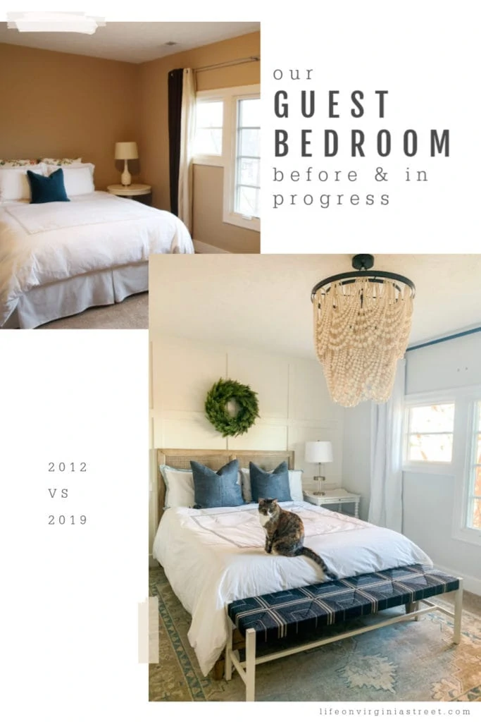 A large white heavy beaded chandelier in the guest bedroom. There is a cat on the bed.