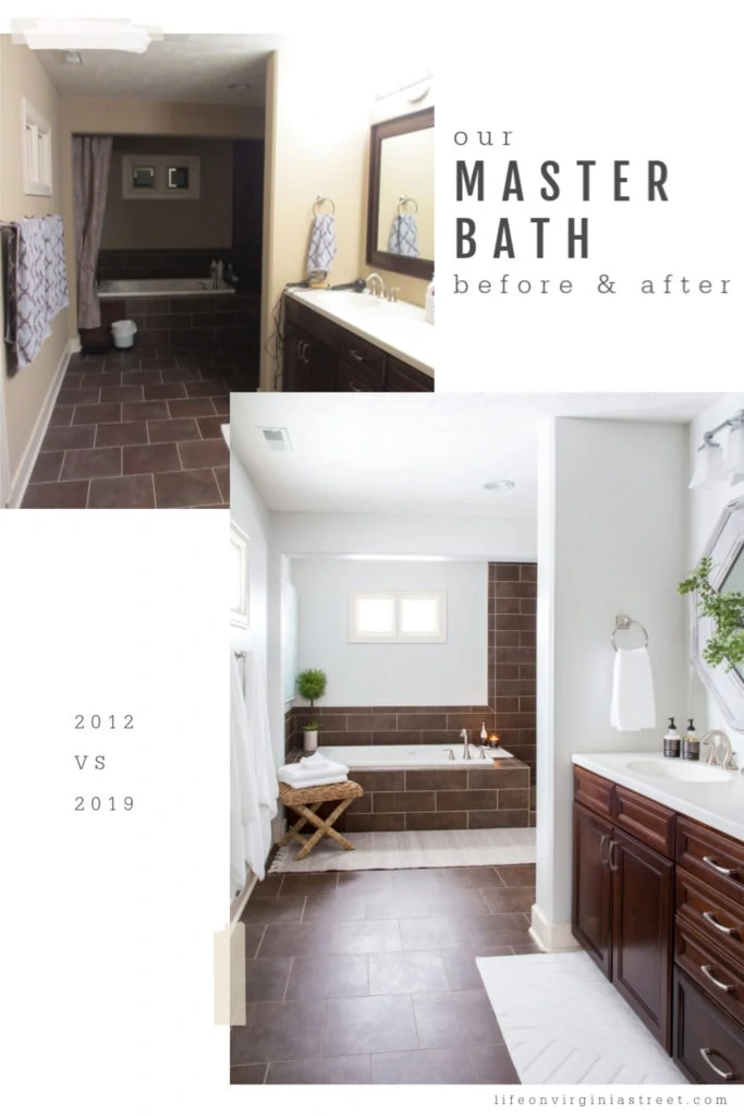 Master bathroom painted white with brown tile and brown vanity.