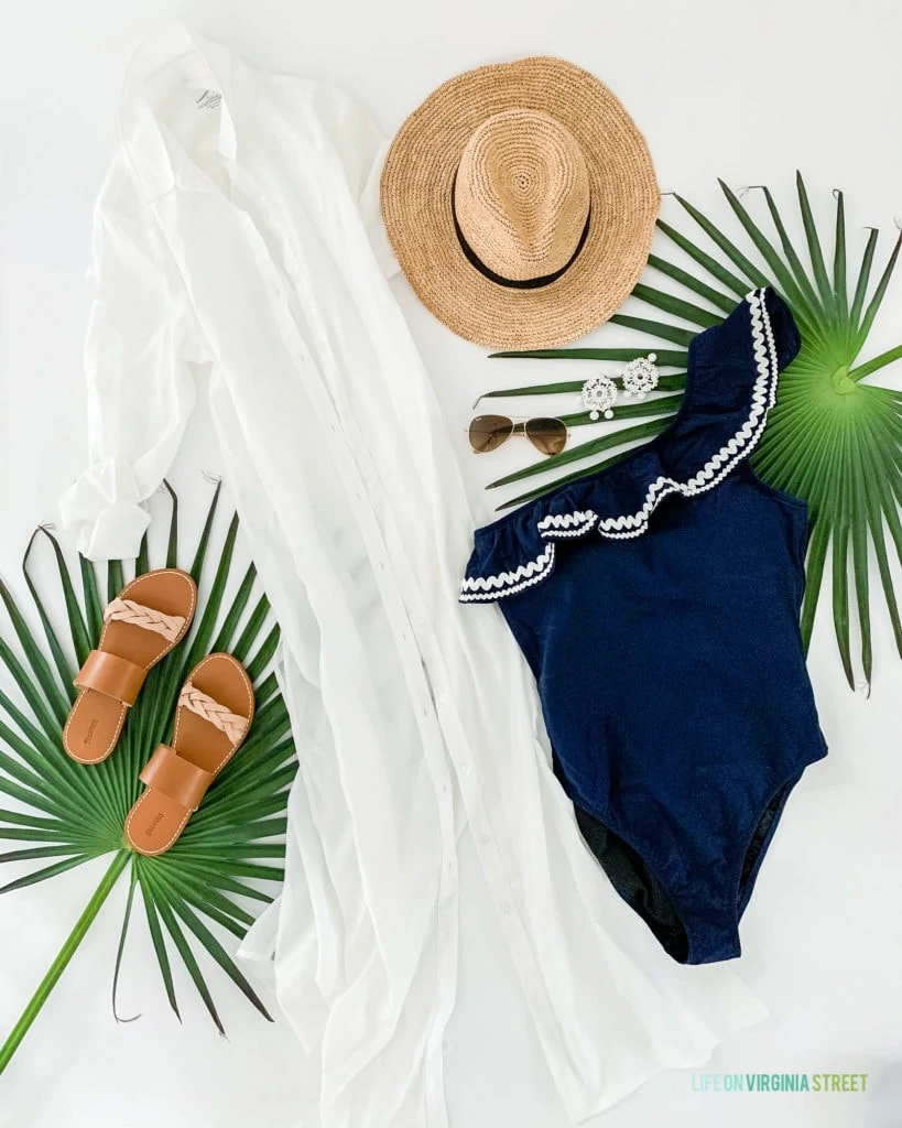 Nevis outfits and ideas on what to pack for a tropical vacation at a resort! I love this long white coverup paired with this navy blue ric rac bathing suit and straw hat!