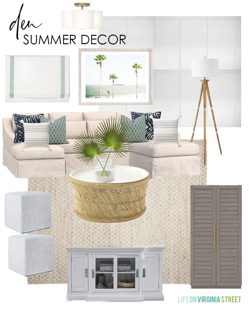 Summer decorating ideas for a den with a linen sectional sofa, bamboo coffee table, shutter storage cabinet, palm tree art, and blue and white pillows.