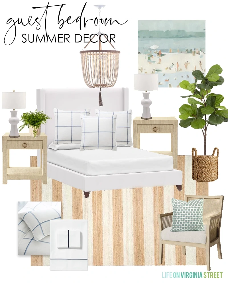 Summer decorating ideas for a guest bedroom with a white upholstered bed, striped jute rug, bead chandelier, and abstract beach art.