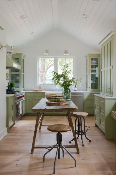 Behr Avocado Whip kitchen cabinets with white walls and ceiling.