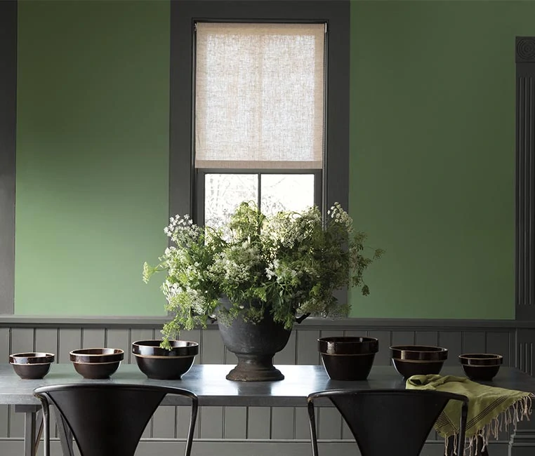 Benjamin Moore Palace Green Dining Room with dark accents and trim.