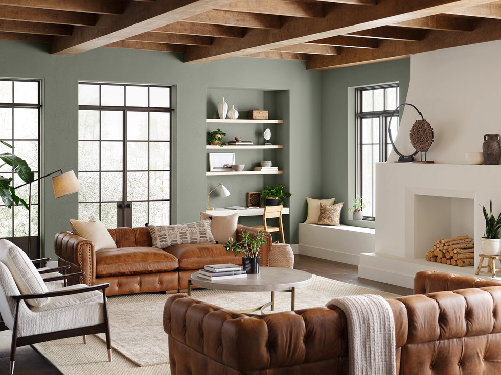 Sherwin Williams Evergreen Fog on walls with a warm wood ceiling, leather sofas, and neutral accent decor.