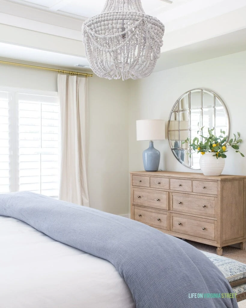 The Pottery Barn Sausalito dresser in a blue and neutral bedroom!