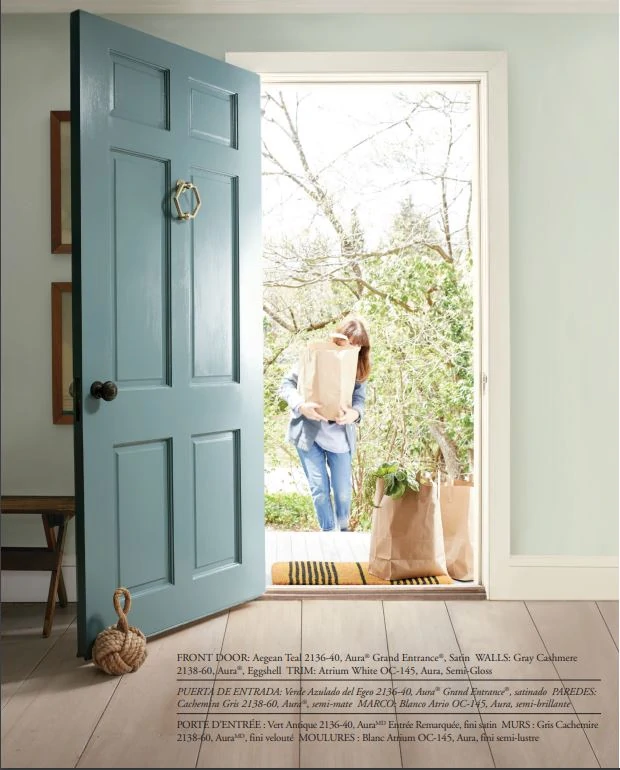 A front door painted Benjamin Moore Aegean Teal, the BM 2021 Color of the Year!