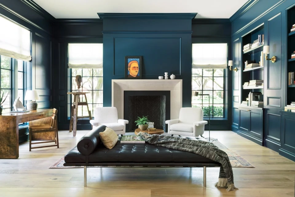 High-gloss Farrow & Ball Hague Blue walls in a moody home library. A perfect dark blue green paint color!