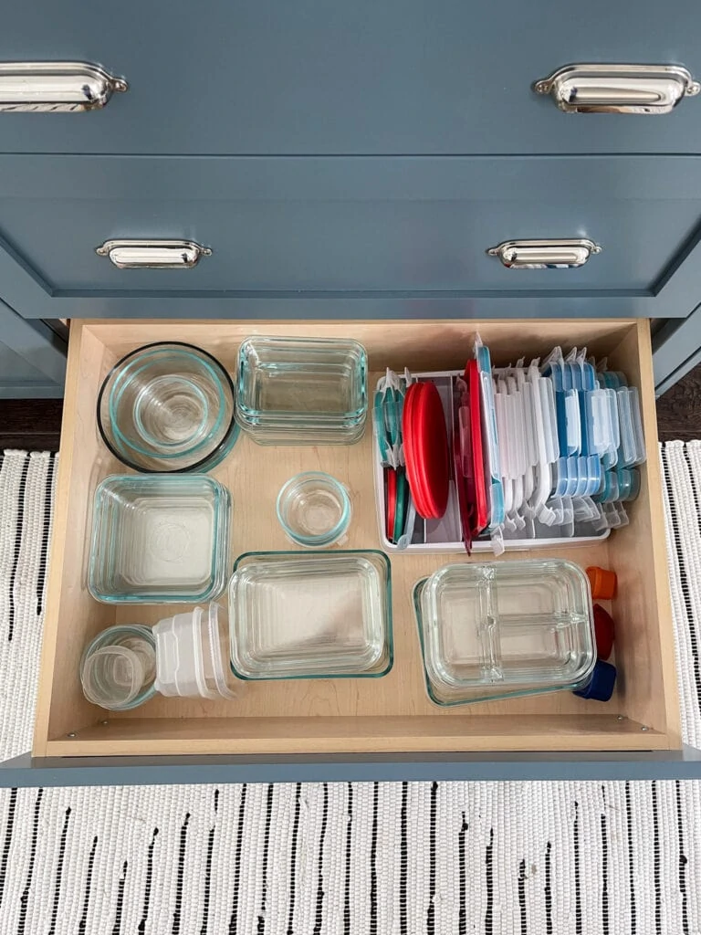 Tips on how to organize kitchen drawers, including food storage containers and lids.