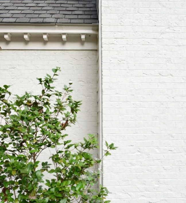 white brick wall house