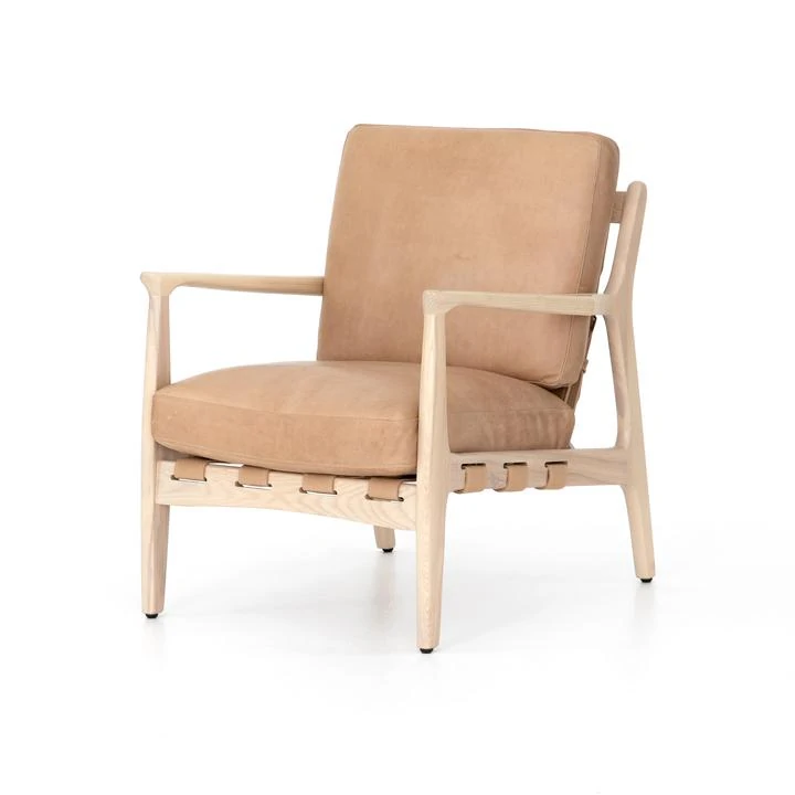 A light leather armchair with light ash wood frame. Perfect for a modern coastal living room chair!