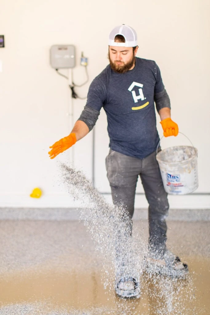 Hello Garage installing our new polyaspartic garage floor coating.