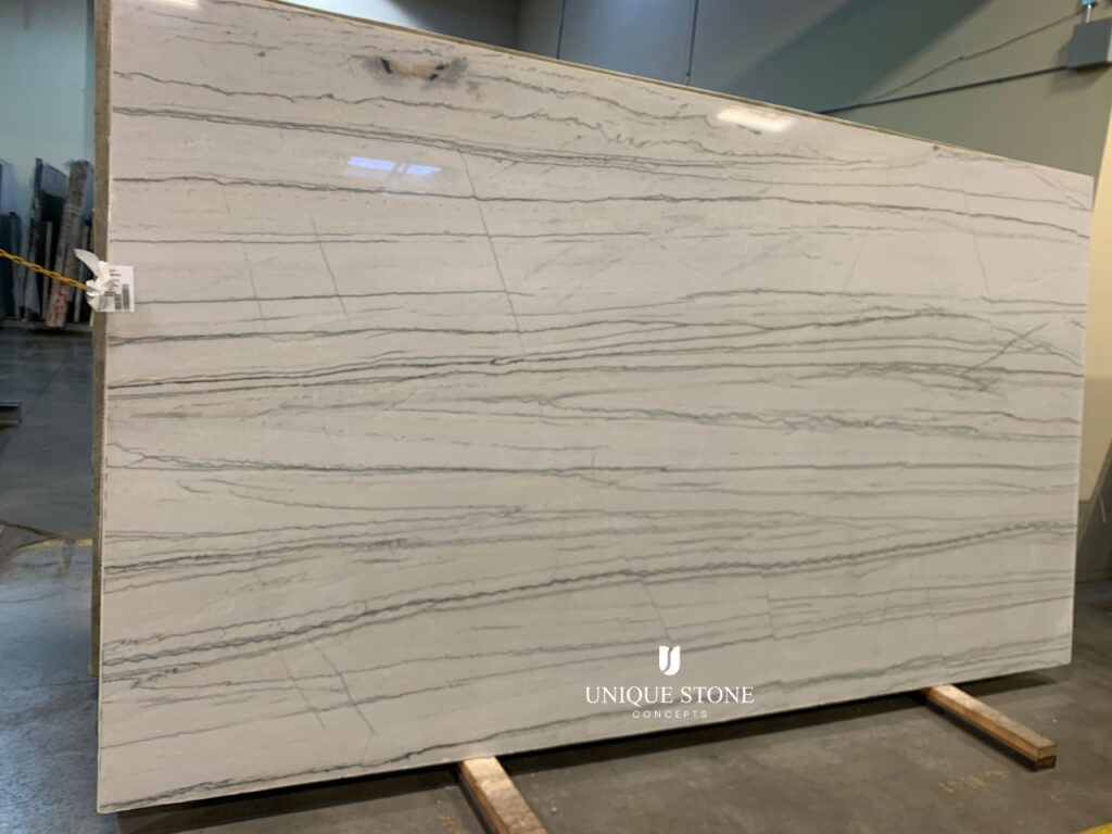 One of the two White Macaubus Quartzite slabs we'll be using on our pool house countertops. We found them at Unique Stone Concepts in Omaha.