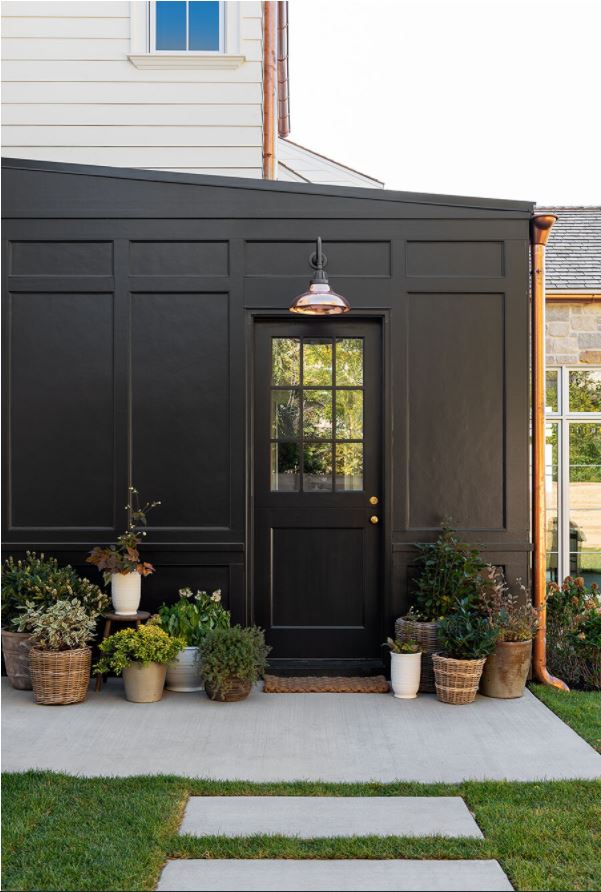 Sherwin Williams Black Magic painted exterior home with board and batten details.