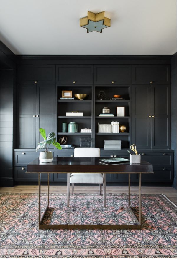 A home office painted in Benjamin Moore Soot, a blue-gray black paint color.