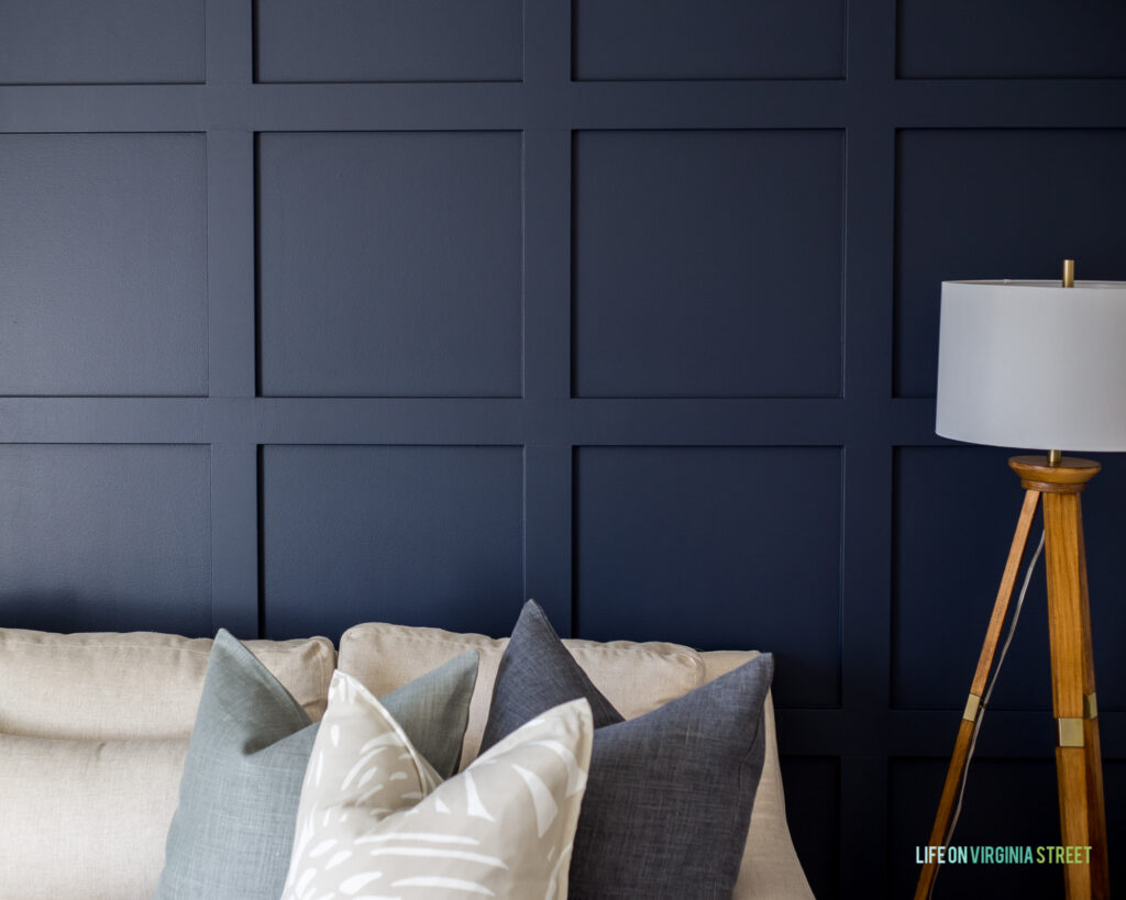 Benjamin Moore Hale Navy painted board and batten wall in a cozy den and TV room!