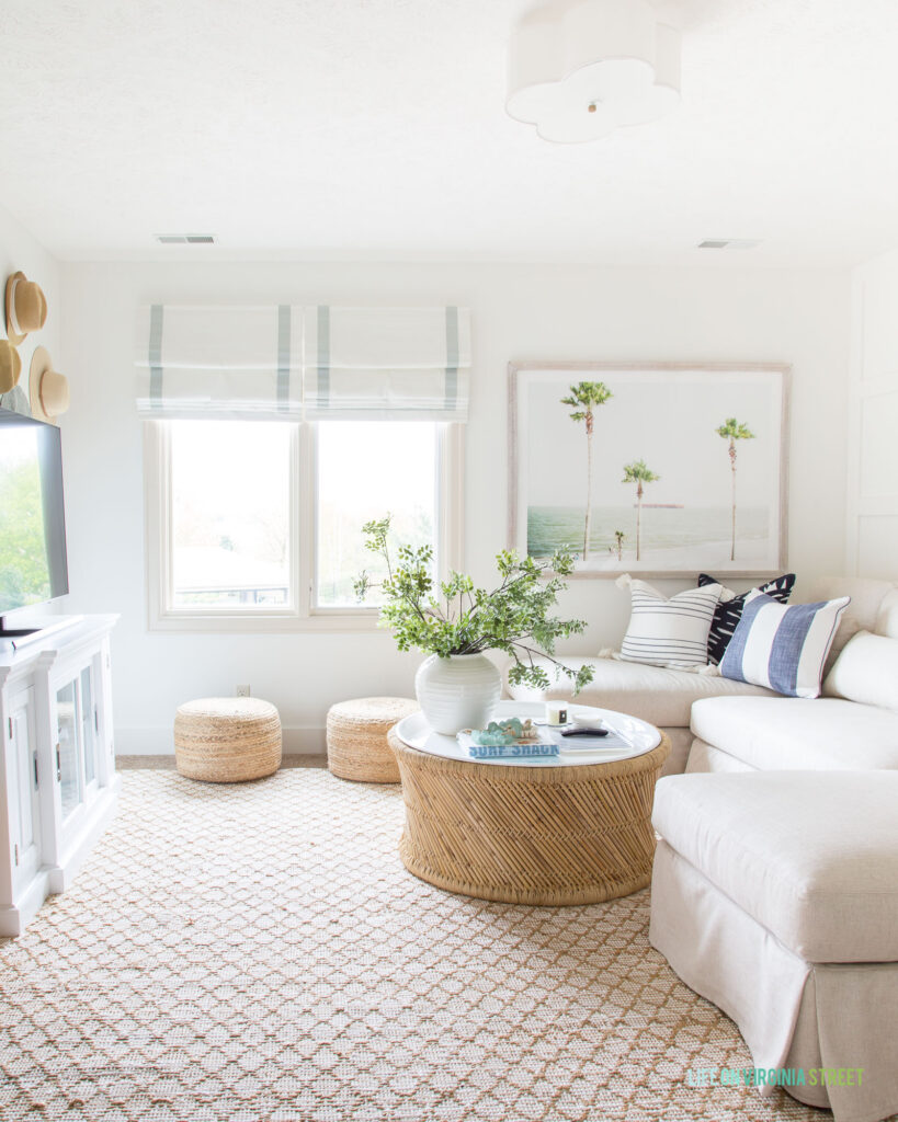 A light and bright living room painted Benjamin Moore Simply White.