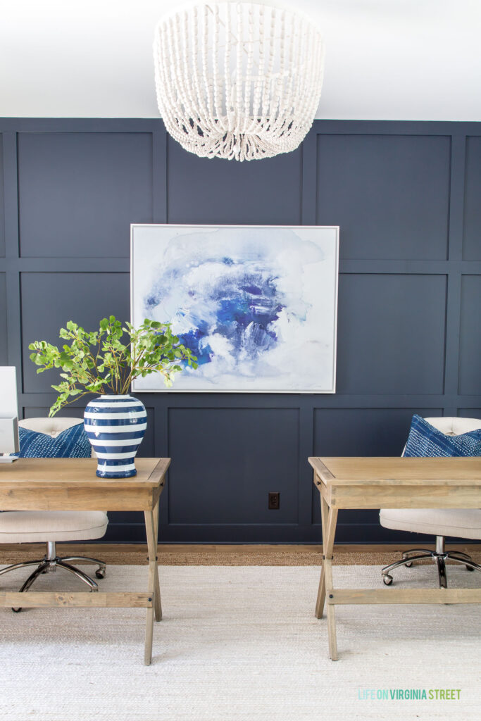 Board and batten grid wall painted Hale Navy from Benjamin Moore in a home office.