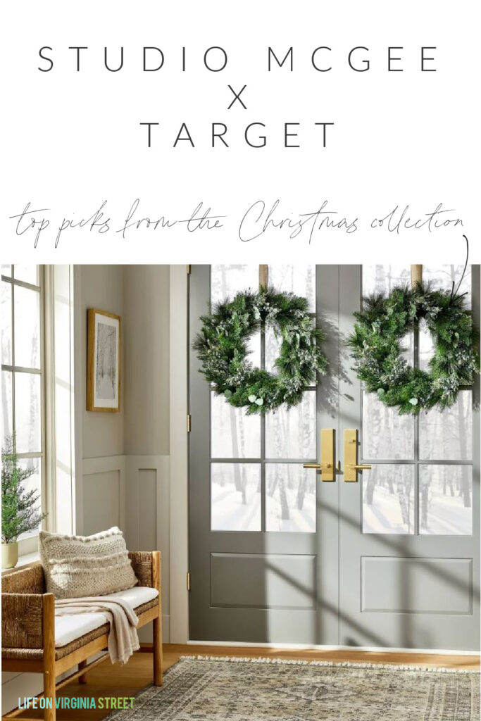 An entryway styled with pieces from the 2022 Studio McGee Christmas Collection at Target! Includes a pair of evergreen wreaths, a woven bunch, a pom pom pillow, winter art, and a vintage style rug.