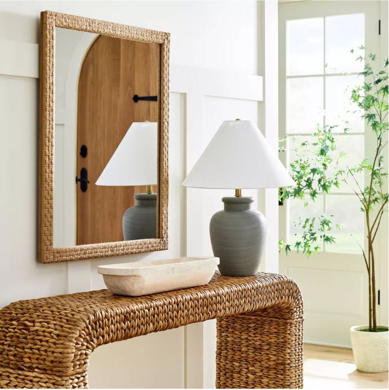 This seagrass waterfall console table, woven mirror, gray lamp, long wood bowl and faux maple tree are all part of the 2023 spring line for Studio McGee at Target!