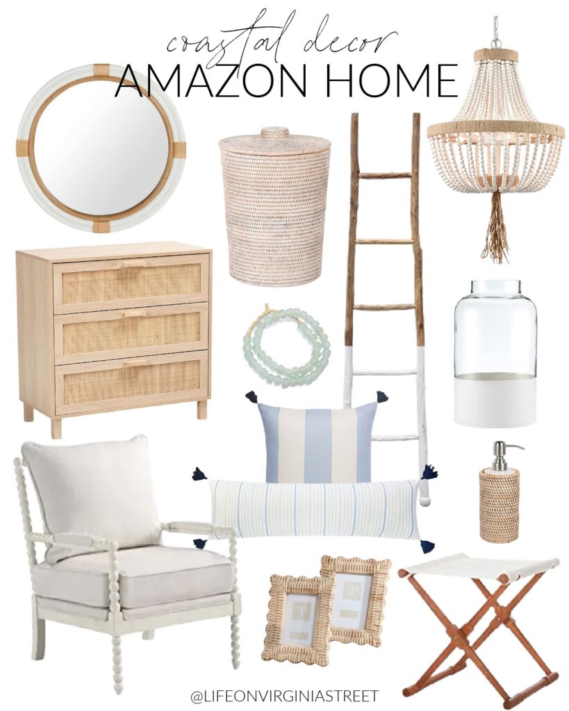 Amazon coastal decor including a white spindle chair, rattan cabinet, white bead chandelier, round white mirror, a white camp stool, paint dipped vase, scalloped rattan picture frame and blue striped pillows.