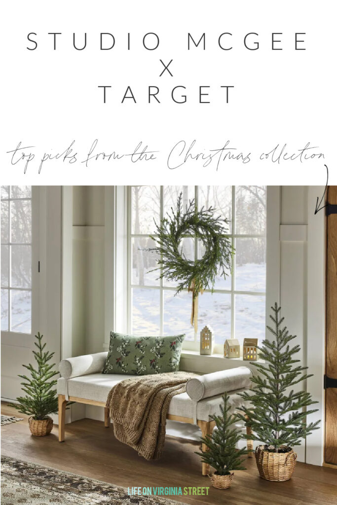 Greenery, including a wreath and mini Christmas tree, from the new Studio McGee Christmas collection at Target! Styled in an etnryway with mini Christmas houses, a neutral bench, and cozy throw blanket.