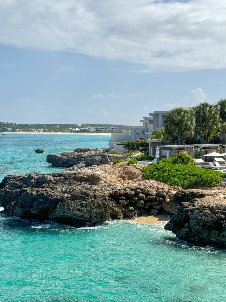 The Four Seasons Anguilla view of the hotel as well as the lava rock and water that surrounds the property.