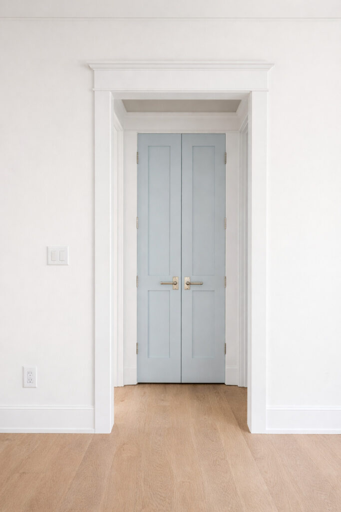 Interior doors painted Benjamin Moore Silver Gray in a room with white oak hardwood floors. Walls and trim are Benjamin Moore Chantilly Lace.